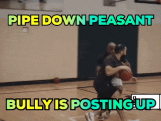 two men playing basketball on a court with the words pipe down peasant bully is posting up above them