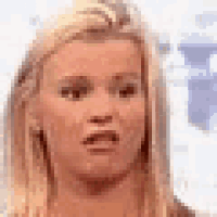 a close up of a woman making a funny face .