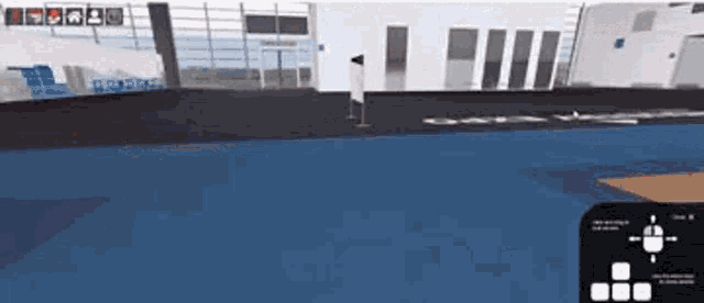 a computer generated image of a room with a blue floor and a white building .