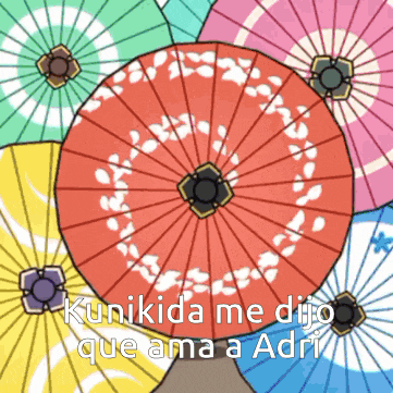 a bunch of colorful umbrellas with the words " kunikida me dijo que ama a adri "