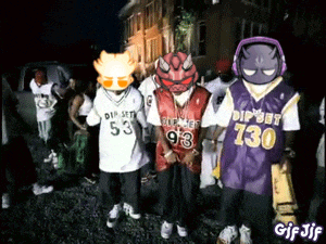 a group of people wearing purple and white jerseys with the number 130 on them