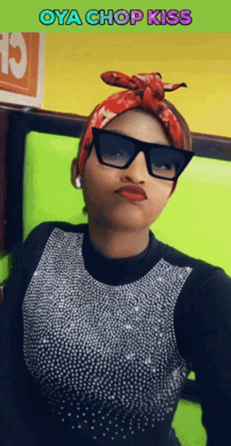 a woman wearing sunglasses and a bandana with the words oya chop kiss below her