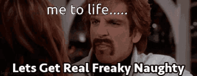 a man with a beard is talking to a woman and says " me to life "