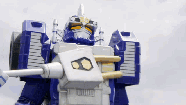 a toy robot with the number 30 on the head