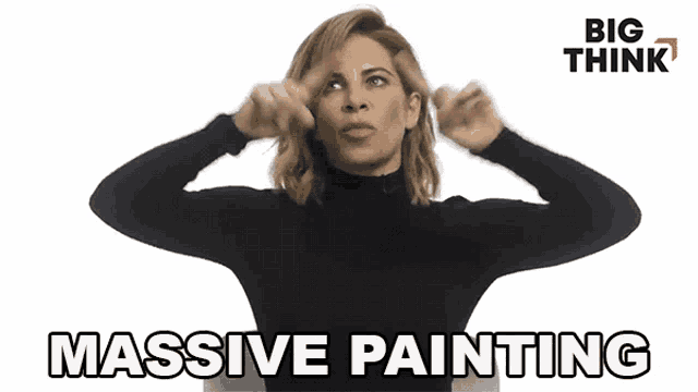 a woman in a black turtleneck is holding a pair of brushes in her hands and says massive painting .