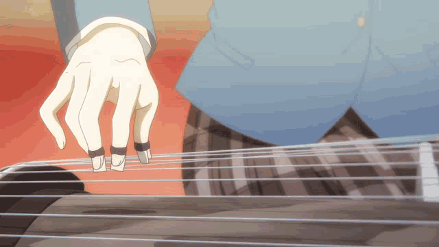 a person is playing a guitar with their fingers on the strings