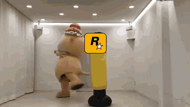 a mascot standing next to a punching bag that says yeehaw on it