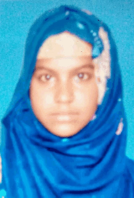a woman wearing a blue scarf on her head