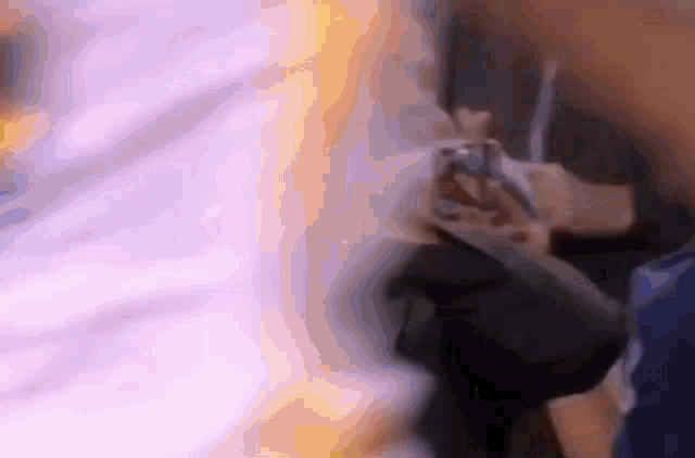 a blurry picture of a person using a phone