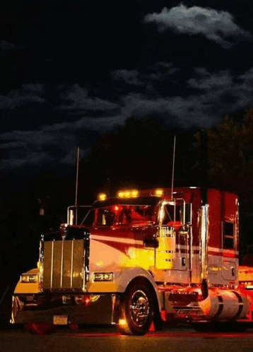 a red and white semi truck with a license plate that says ' aa ' on it