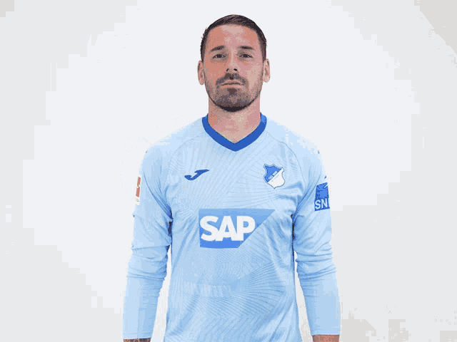 a man in a blue shirt that says sap on it