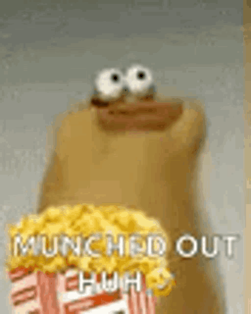 a stuffed animal is holding a bag of popcorn and says `` launched out ehhh '' .