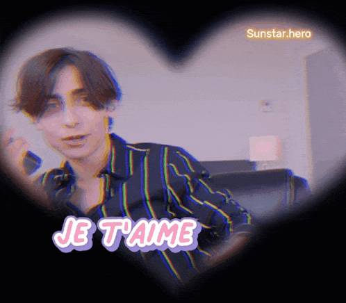 a man in a striped shirt is surrounded by a heart and the words je t'aime
