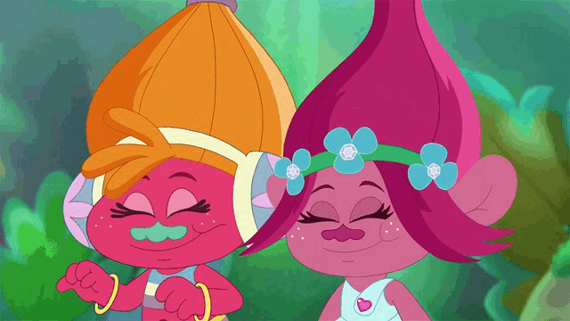 two trolls are standing next to each other and smiling