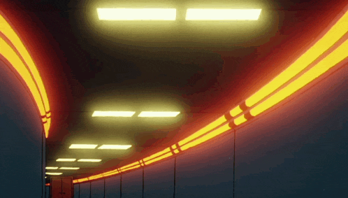 a dark tunnel with a lot of lights on the ceiling