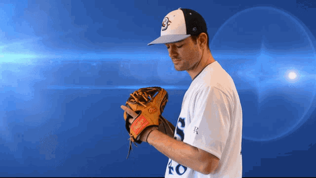 a baseball player wearing a white shirt with the number 40 on the sleeve