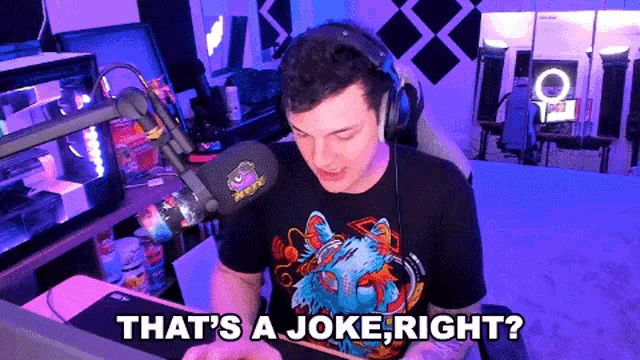 a man wearing headphones and a t-shirt that says ' that 's a joke right ' on it