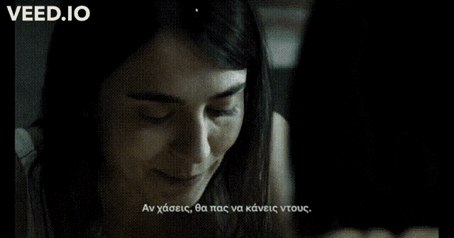 a woman in a yellow shirt is smiling next to another woman with the words veed.io written above her
