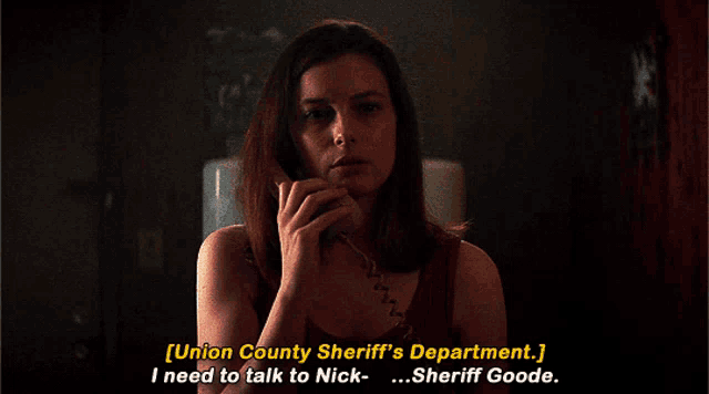 a woman talking on a phone with the words union county sheriff 's department i need to talk to nick
