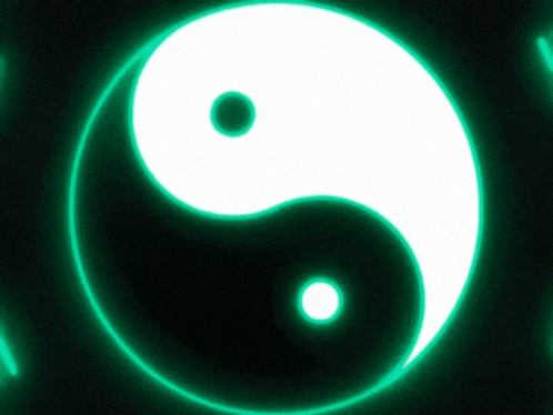 a black and white yin yang symbol is glowing in the dark