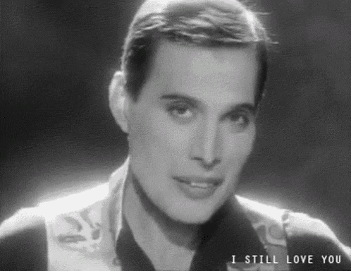 a black and white photo of a man with the words i still love you on the bottom .