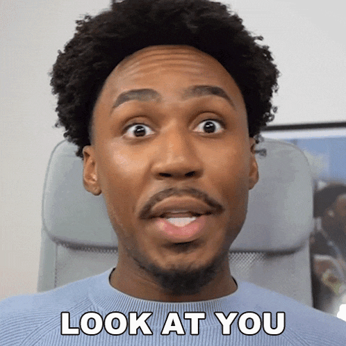 a man with a surprised look on his face and the words look at you above him