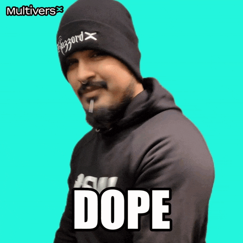 a man wearing a beanie and a hoodie with the word dope on the front
