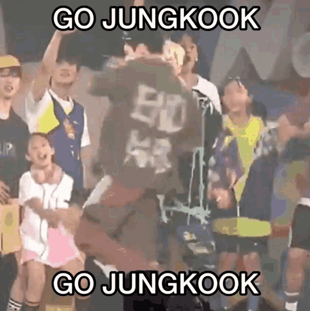 a group of people are gathered around a man with the number 50 on his shirt