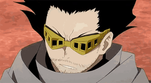 a close up of a man wearing glasses and a scarf