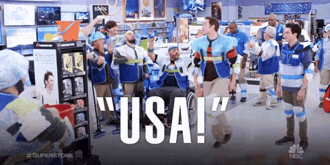 a man in a wheelchair is dancing in a store with the word usa written on the bottom