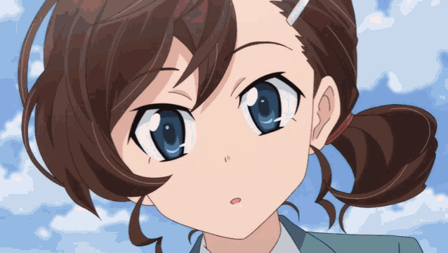 a close up of a girl 's face with a blue eye