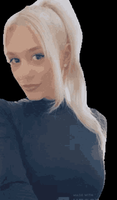 a woman with blonde hair is wearing a black shirt that says made with on the back