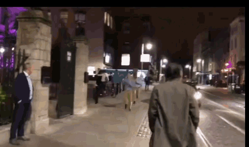 a blurry picture of people walking down a street