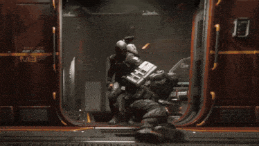 a man is laying on the floor in front of a door that says habitation