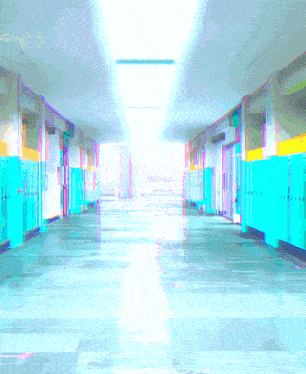 a hallway with blue lockers and a reflection of a person in a mirror