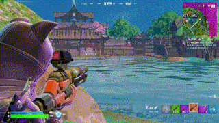 a person is playing a video game with a sniper rifle in front of a body of water .