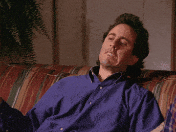 a man sitting on a couch with the words " that 's a shame " written below him