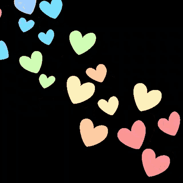 a bunch of rainbow colored hearts on a black background