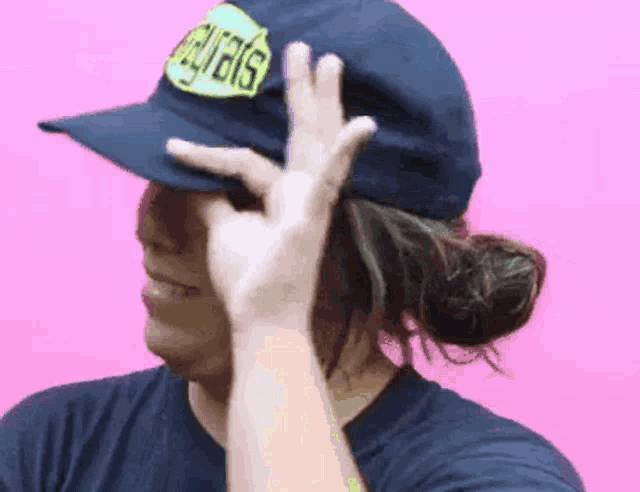 a person wearing a hat that says ' aguilas ' on it