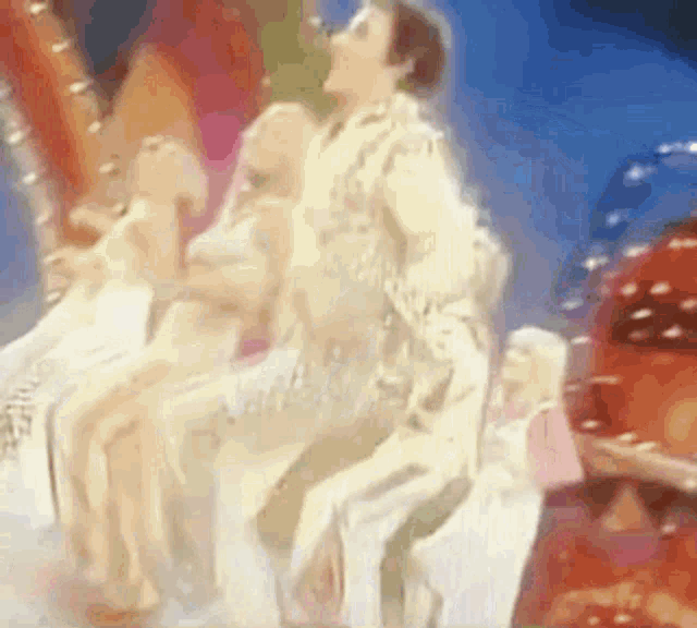 a blurry picture of a group of people dancing on a stage