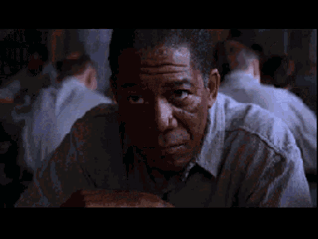 a man in a prison uniform with the number 265 on his shirt