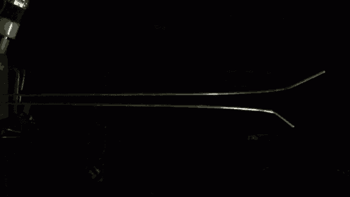 a dark room with a light coming out of the bottom