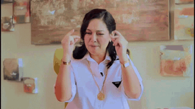 a woman in a white shirt with the word fighting written on it