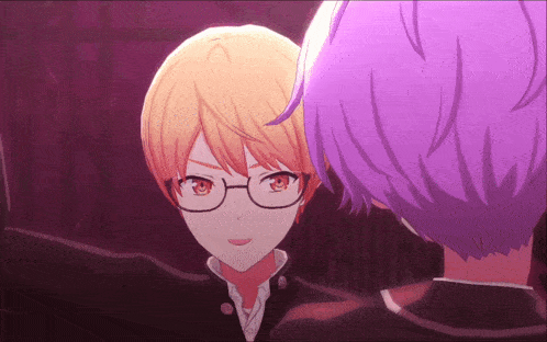 a boy with glasses and purple hair stands next to another boy with purple hair
