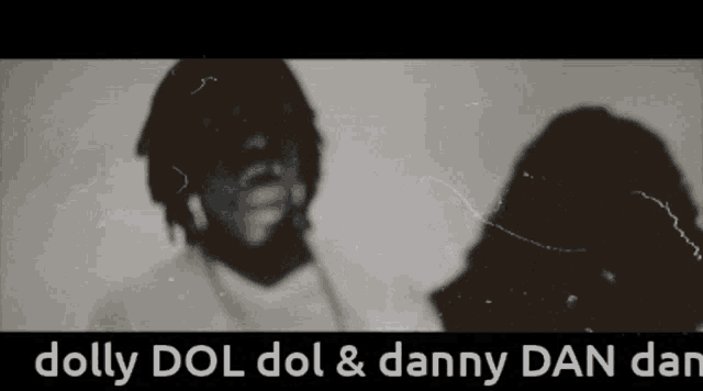 a black and white photo of a man and woman with the words dolly dol dol & danny dan dan below them