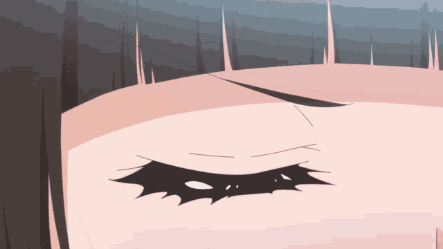 a close up of a girl 's eye with a black eyebrow
