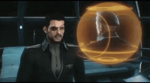 a man in a suit stands in front of a sphere with a man 's head in it