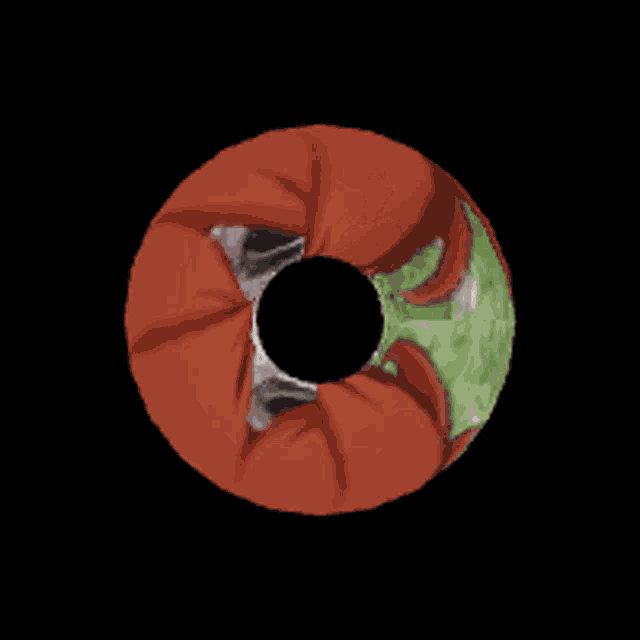 a globe with a red scarf around it and a black hole in the center