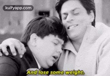 a black and white photo of a man and a boy with the words " and lose some weight " on the bottom