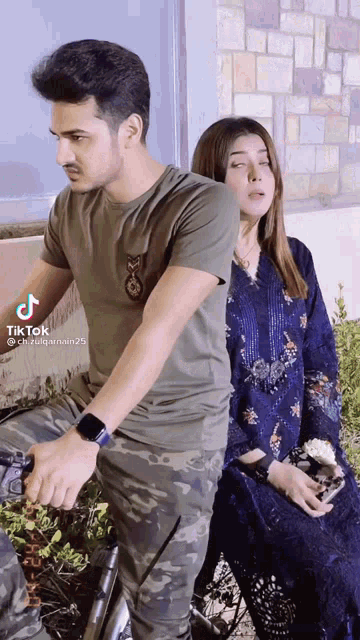 a tiktok video of a man and a woman sitting on a bench